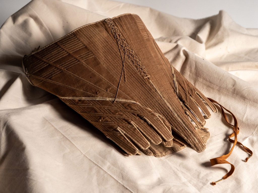 A pair of buff coloured leather gauntlet gloves circa 1650. Museum Ref: 2760/B