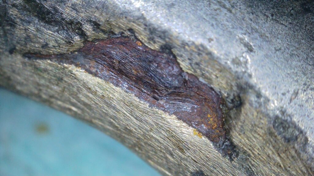 Close up of iron core and yellow metal used as a repair